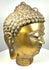 Vintage Buddhist Buddha head featuring elongated earlobes, finely defined facial contours, and naturally darkened patination around the ears and hair.