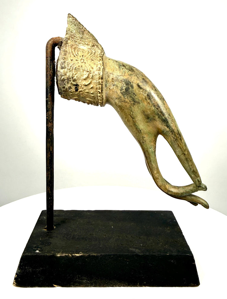 19th-century Thai Buddhist bronze hand fragment displaying elongated fingers, a gold-toned surface, and intricate floral ornamentation associated with the Rattanakosin period.