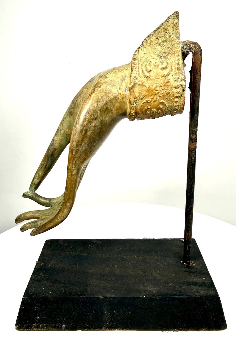 Historic Southeast Asian bronze hand fragment featuring a hollow wrist opening, exposed interior casting details, and age-related surface wear.