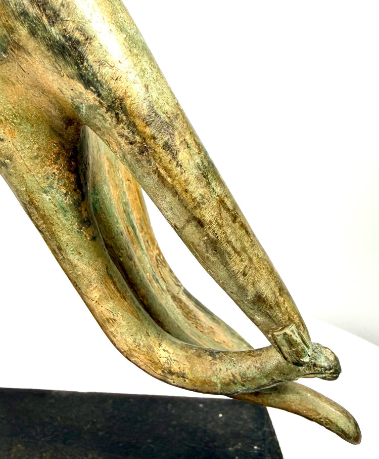 Thai Rattanakosin-period Buddhist hand sculpture featuring a richly ornamented cuff, flowing floral relief patterns, and a distinctive circular finger arrangement.