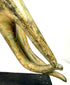 Thai Rattanakosin-period Buddhist hand sculpture featuring a richly ornamented cuff, flowing floral relief patterns, and a distinctive circular finger arrangement.