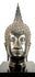 19th-century Rattanakosin period Buddha head with elongated facial proportions and traditional Thai Buddhist sculptural details.