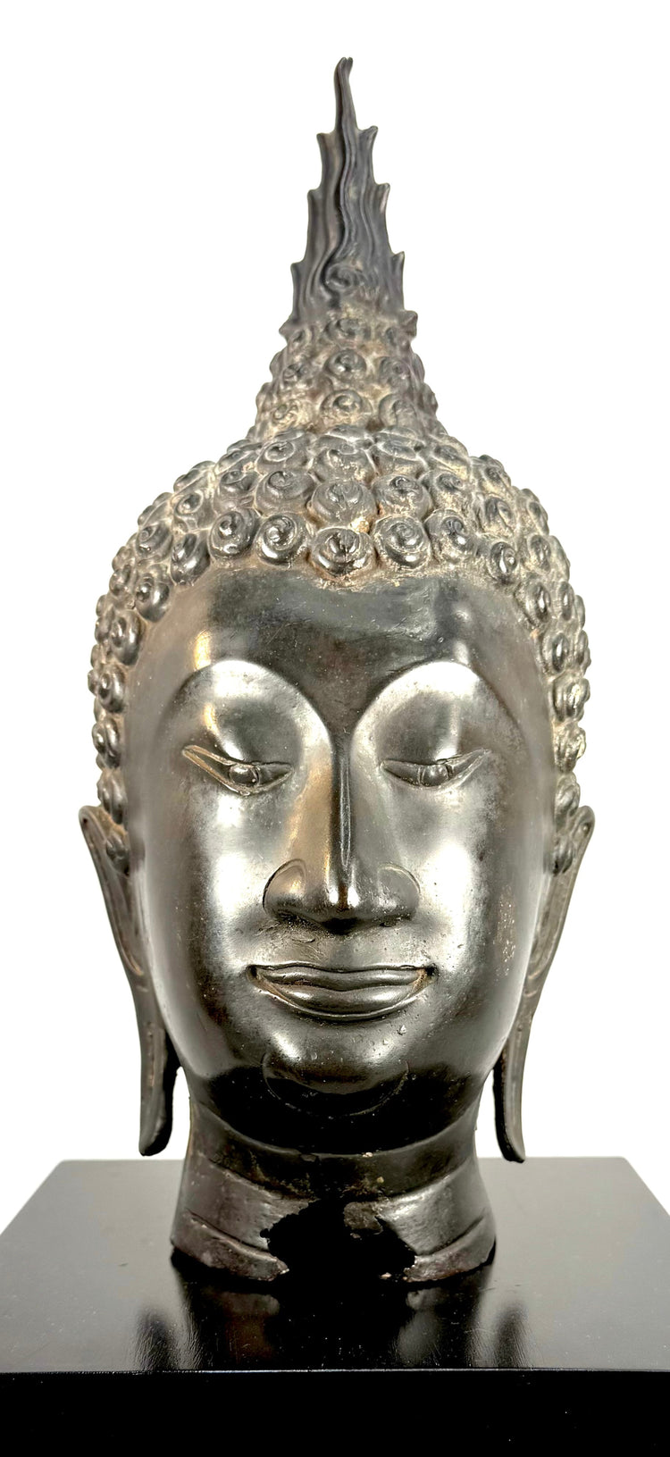 19th-century Rattanakosin period Buddha head with elongated facial proportions and traditional Thai Buddhist sculptural details.