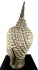 Buddha sculpture with softly defined lips forming a gentle meditative smile, reflecting traditional Thai Buddhist artistry.