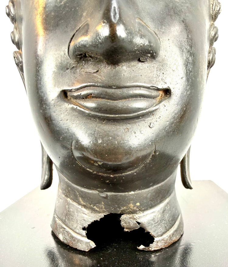 Large Thai Buddha head with a cylindrical neck section, defined lower rim, and traditional cast metal construction.
