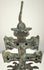 Antique Caravaca crucifix displaying the Virgin Mary beneath the Crucifixion, surrounded by decorative relief and aged bronze patination.