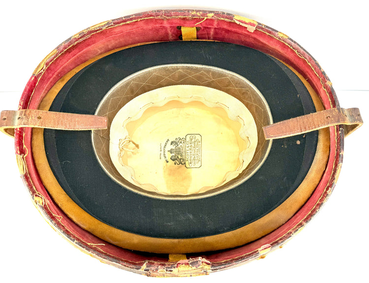 Historic top hat travelling case with its original textile-lined interior, red edging, and fitted hat supports.