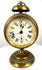 Historic German pedestal alarm clock with a prominent domed brass bell, exposed striking mechanism, and circular carrying ring.