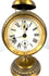 Jahresuhrenfabrik alarm clock displaying the diamond-shaped J–UF manufacturer's trademark on its aged cream-coloured dial.