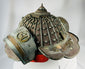 Japanese Edo era firefighting helmet with ornate design and aged patina