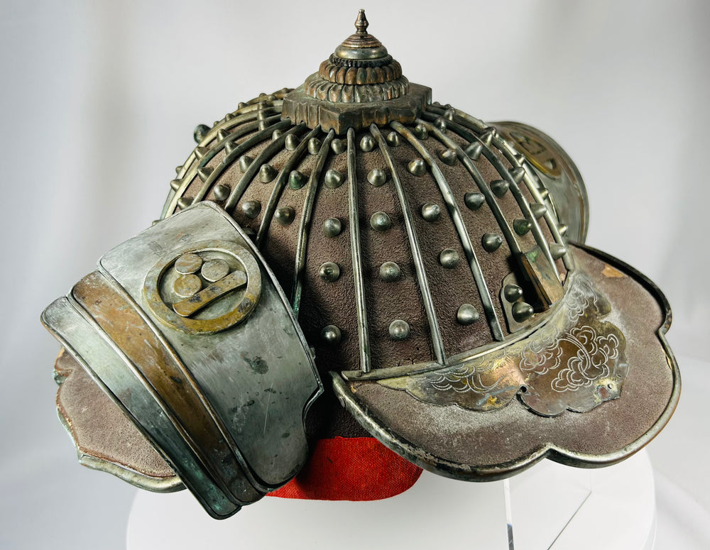 Edo period Japanese firefighter helmet with brass crests and red interior lining