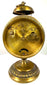 Early 1900s German mechanical clock featuring raised geometric brass decorations surrounding its circular case and pedestal base.