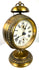 Decorative brass pedestal clock featuring a circular foot, raised ornamental detailing, and natural golden metallic patination.