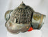 Antique Japanese fireman helmet with riveted iron dome and wide brim