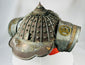 Antique Japanese fireman helmet with riveted iron dome and wide brim