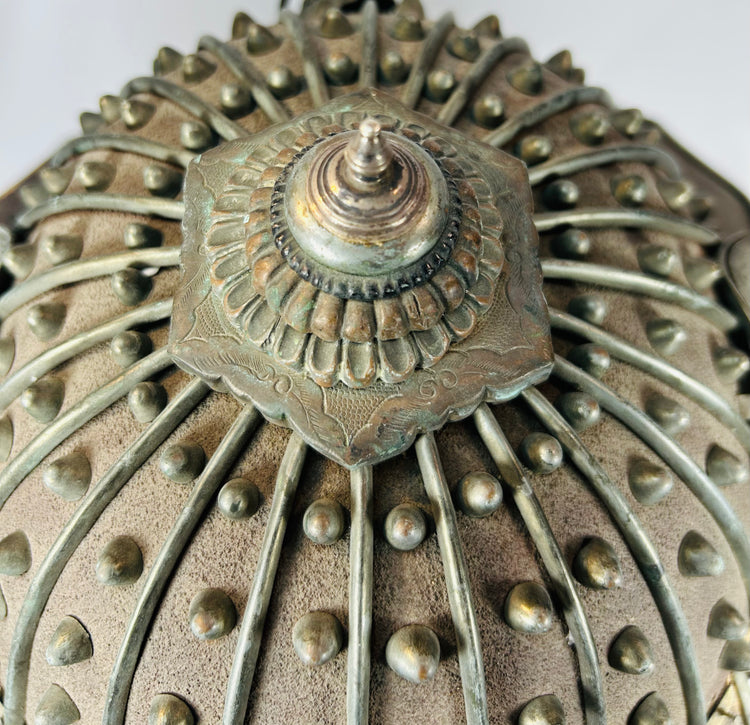 Traditional Japanese hikeshi helmet with ribbed iron construction and finial