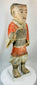 Chinese funerary terracotta warrior figure with stylized armor and painted features