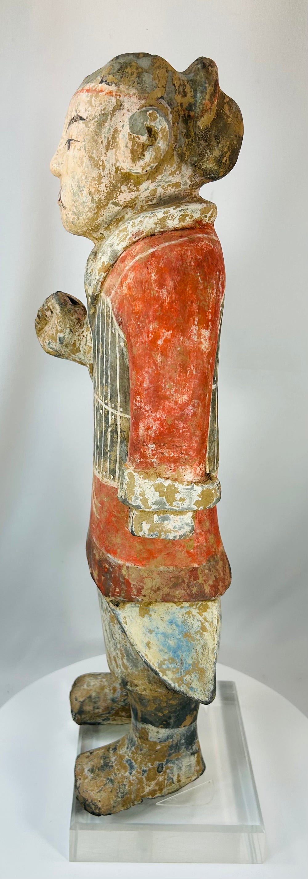 Terracotta soldier figure with natural aging and archaeological surface texture