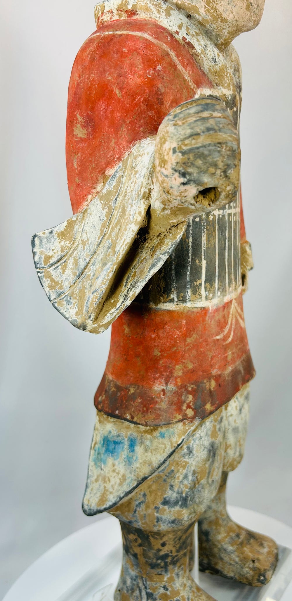 Excavated terracotta figure with hollow arms and original pigment traces