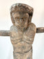 Latin American carved Christ figure with elongated form and expressive features