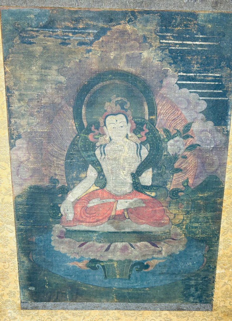 Hand-painted silk Buddhist artwork with haloed figure and decorative border