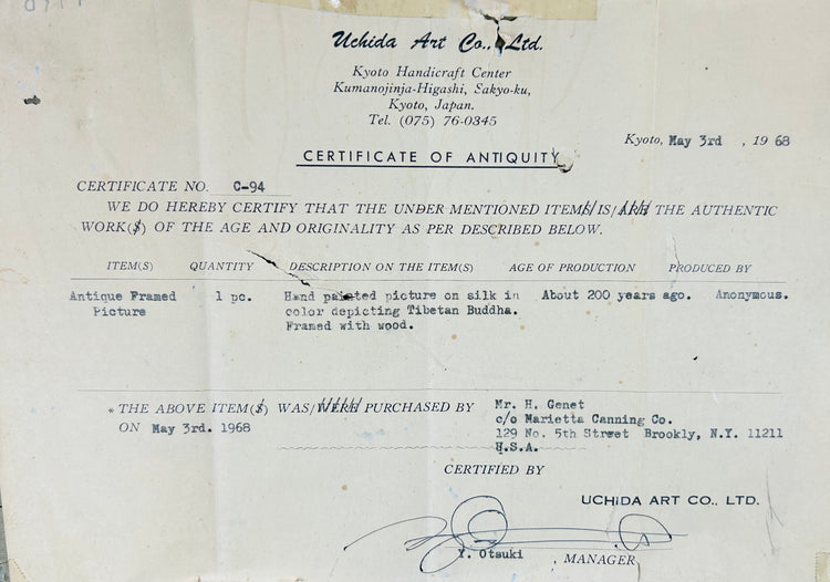 Framed Himalayan religious painting with seated Buddha and ornate detailing