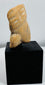 Pre-Columbian anthropomorphic terracotta head fragment exhibiting weathering consistent with long-term burial.