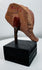 Ancient figural ceramic fragment mounted on display stand, retaining painted decoration and burial patina