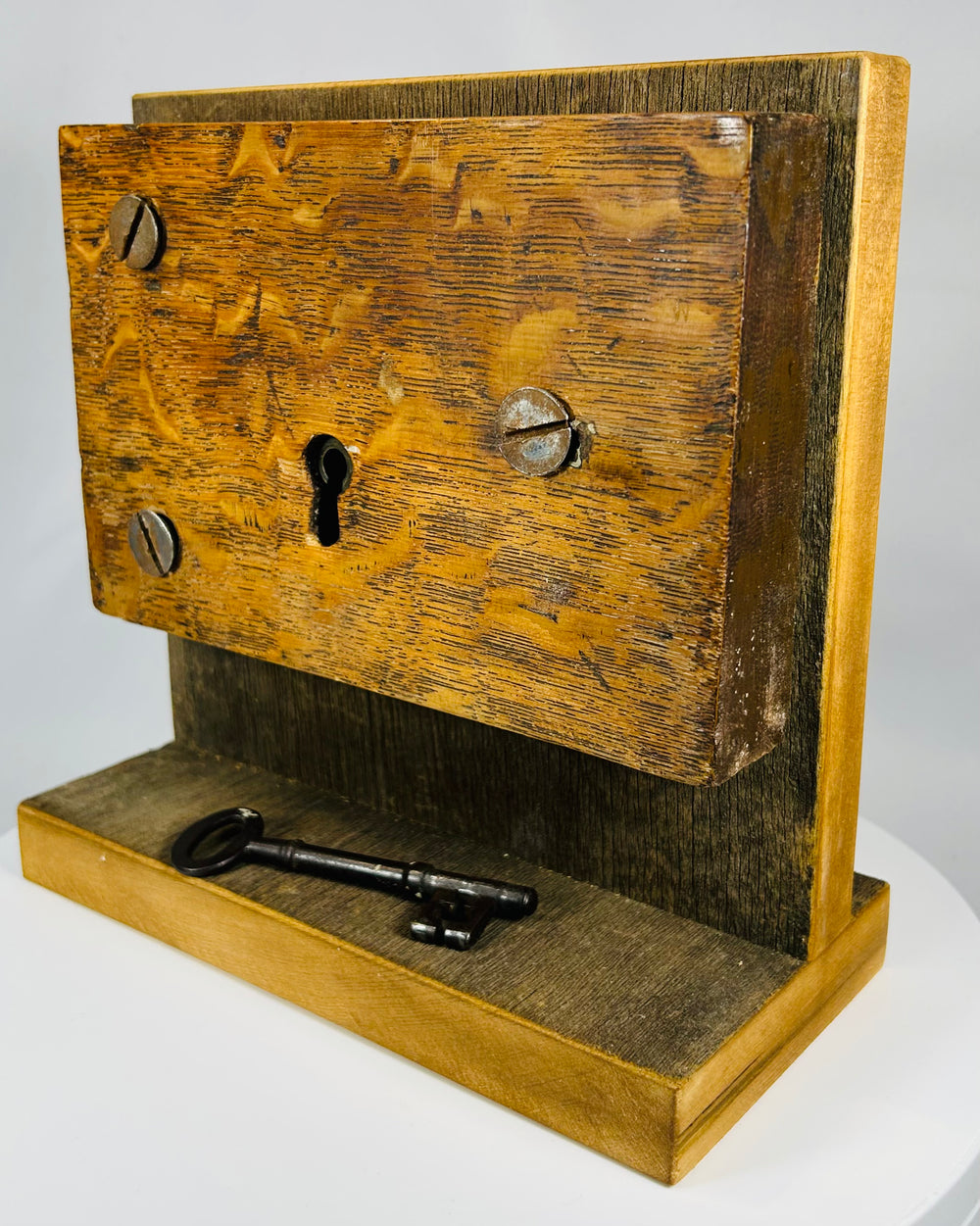 19th century door lock hardware with hand-forged screws and keyhole detail