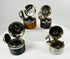 Antique cylindrical inkwells designed for travel and writing on the go