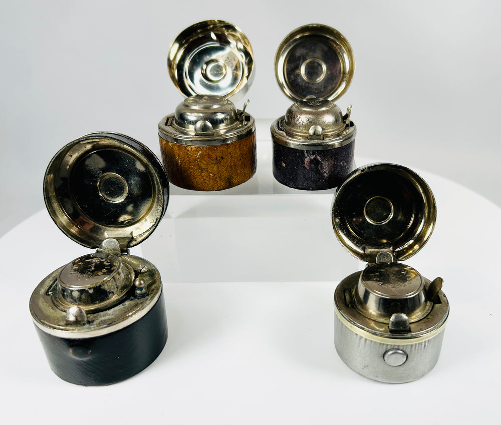 Early 20th century inkwell set with metal lids and internal glass inserts