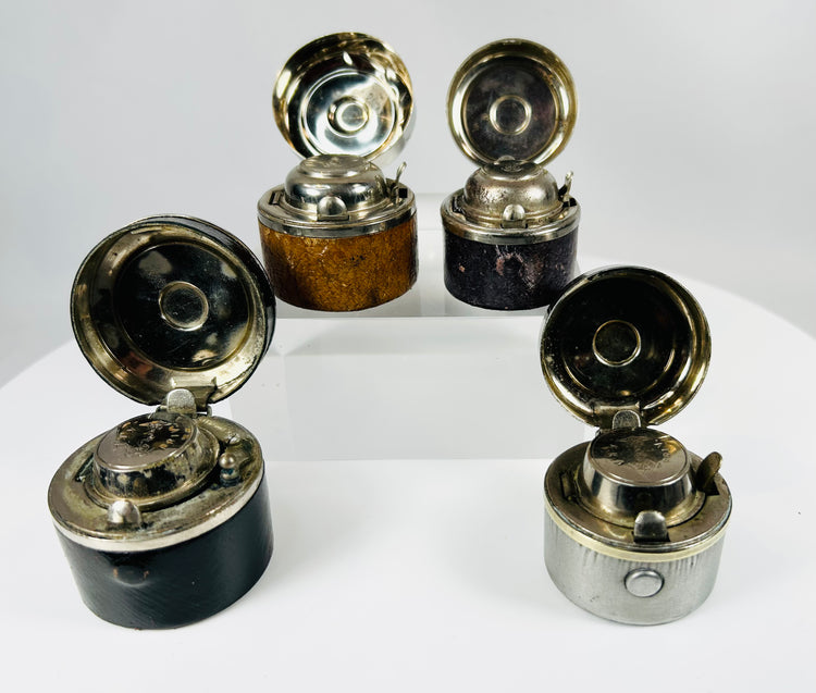 Early 20th century inkwell set with metal lids and internal glass inserts