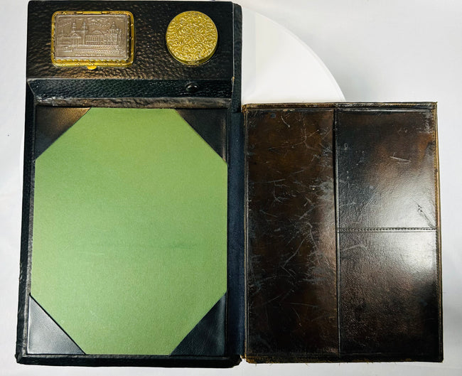 Leather-covered writing slope with brass fittings and inkwell section