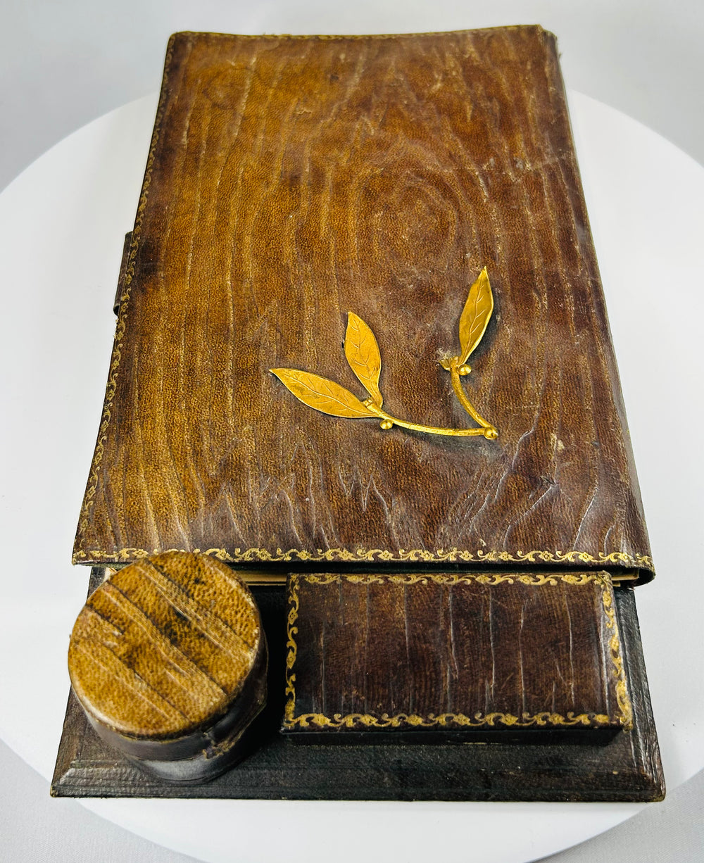 Antique lap desk with interior compartments and glass inkwell reservoir