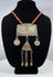 Antique Turkmen tribal jewelry with suspended coin elements, red glass beads, and handcrafted silver-toned metalwork.