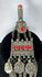 Antique Kuchi tribal ornament with a cylindrical prayer tube, decorative medallions, and long suspended chains.