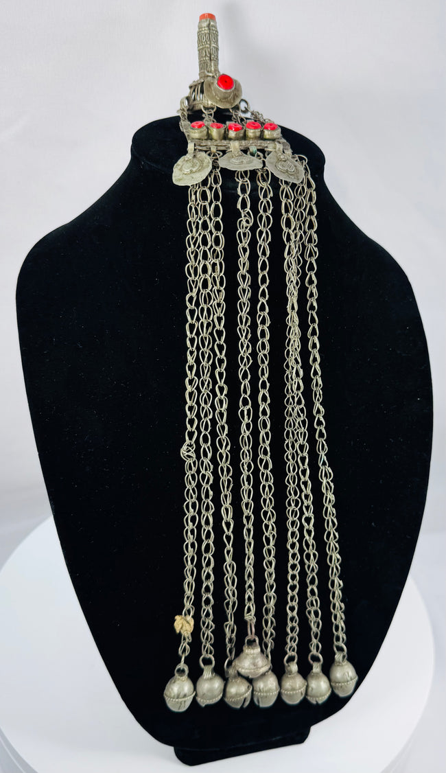 Historic Kuchi pendant ornament from Afghanistan featuring a hirz prayer tube, red cabochons, and bell-shaped dangles.