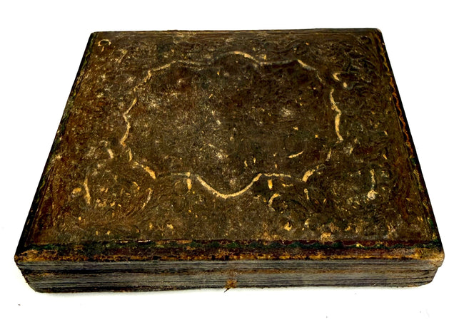 Antique 19th-century American portrait case displaying elaborate raised foliate patterns and surviving gilt decorative accents.