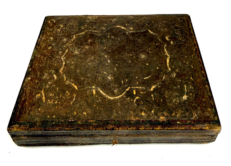 Antique 19th-century American portrait case displaying elaborate raised foliate patterns and surviving gilt decorative accents.