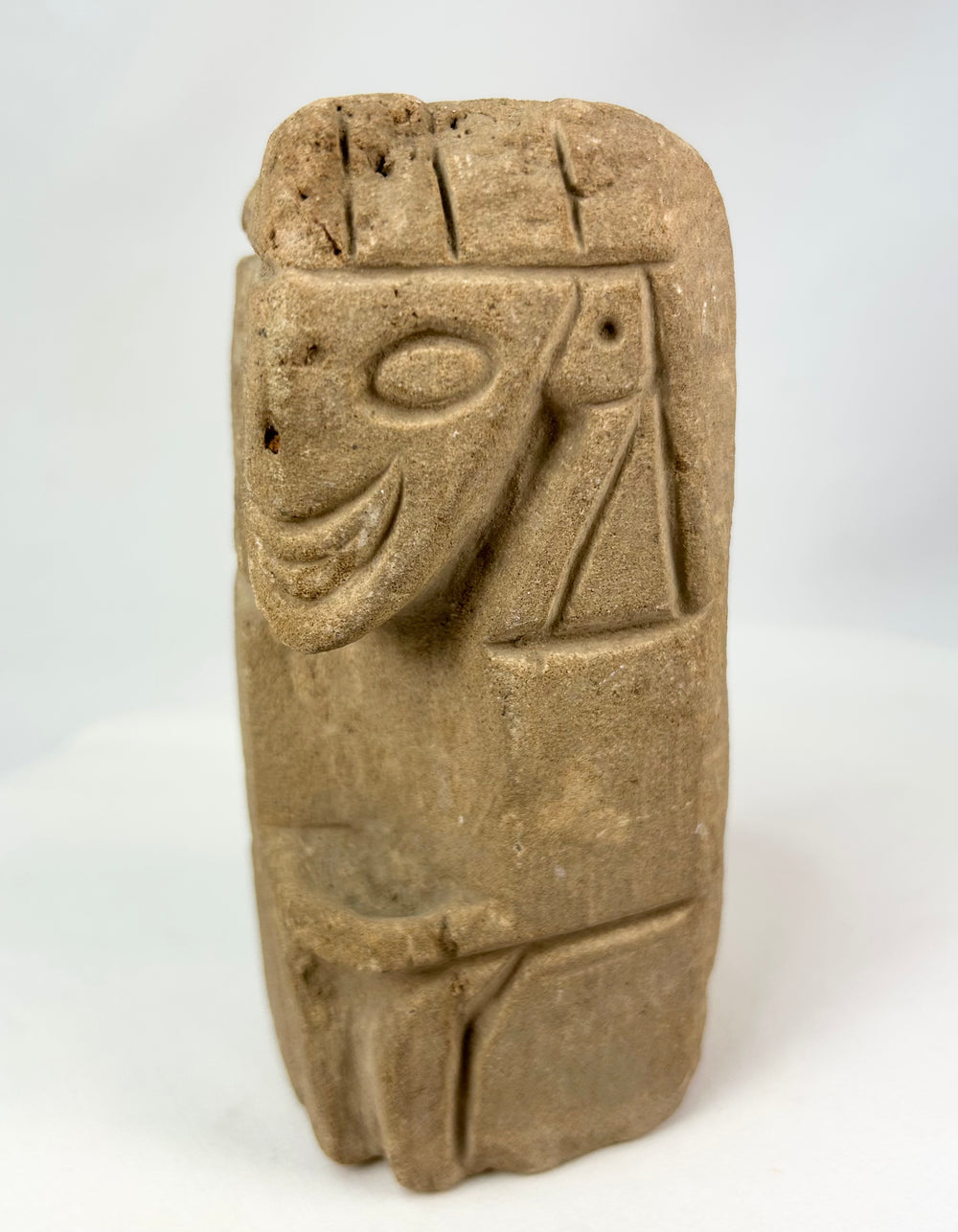 Ancient Pre-Columbian stone anthropomorphic figure with abstracted form and aged patina