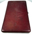Exterior view of a late Victorian burgundy leather-covered photographic presentation case with visible age-related surface wear.