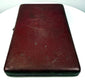 Reverse exterior of the closed Victorian portrait case showing its burgundy leather covering, textured surface, and aged patina.
