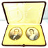 Front view of two antique colour portrait miniatures arranged side by side within an elegant burgundy leather-covered presentation case.