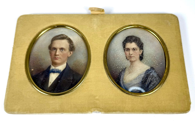 Removable double portrait panel featuring oval colour images of a Victorian gentleman and woman set in gilt-coloured frames and cream velvet.