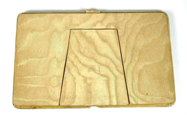 Reverse of the antique double portrait panel showing its cream-coloured backing and integrated folding easel support.