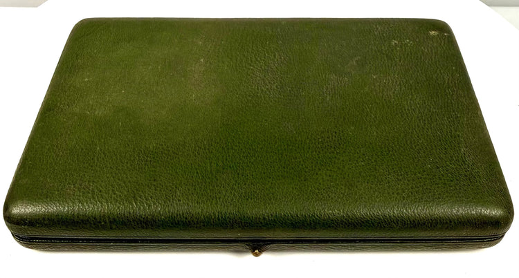 Closed Victorian–Edwardian portrait presentation case featuring a textured dark green leather exterior and rectangular construction.