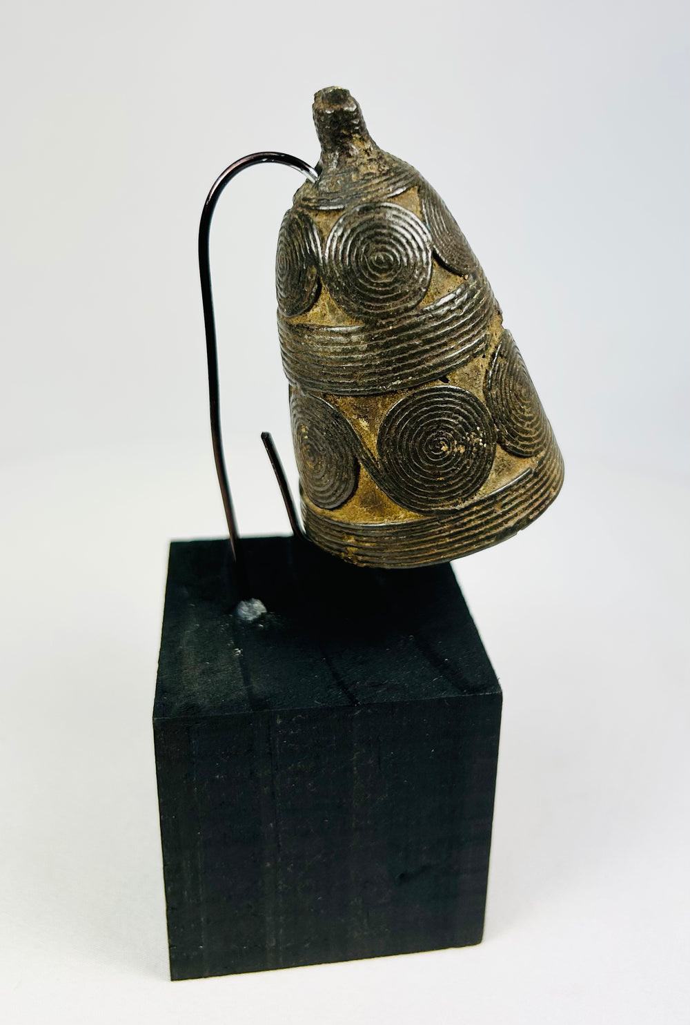 Cast bronze Tibetan ceremonial bell used in Vajrayana Buddhist rituals.