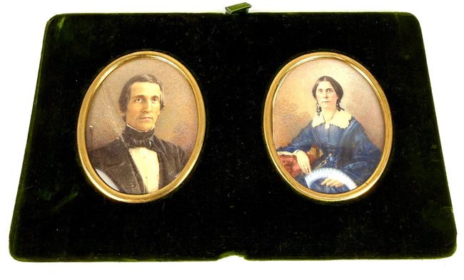 Removable double portrait panel featuring colour miniatures of a gentleman and woman in gilt-coloured oval frames against dark green velvet.