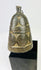 Tibetan ritual ghanta bell displaying detailed casting and traditional Buddhist symbolism.