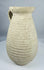 Ancient Roman terracotta pitcher from Africa Proconsularis with ribbed body and flared rim.
